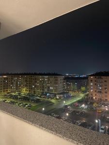a view of a parking lot at night at Diva apartman in Donje Mladice
