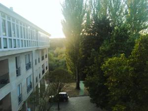 a car parked in a parking lot next to a building at Apartamento Ziralla- con Garaje Gratis in Allariz