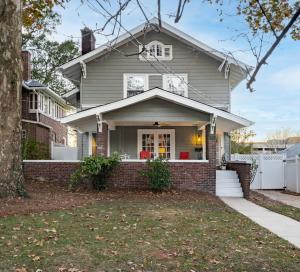 a gray house with a red brick at Southern Tides- Pool, Fire Pit & Games in Birmingham