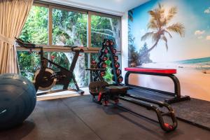 a gym with a view of the beach at Villa Cholchalee - By Sp Villa Management in Amphoe Koh Samui