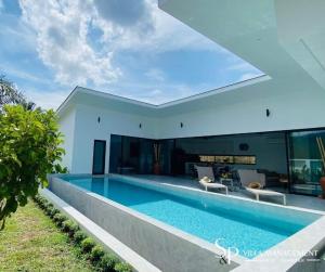 a swimming pool in the backyard of a house at Villa Noi by SP Villa Management in Koh Samui