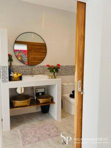 a bathroom with a sink and a mirror at Villa Noi By Sp Villa Management in Koh Samui  +17 photos