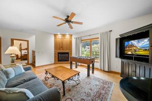 a living room with a couch and a table at Chetola: Sierra 1 in Blowing Rock