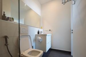 a small bathroom with a toilet and a sink at Tropical apartments in The Soul 400m from Paje beach - Managed by KSN in Paje