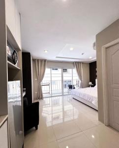 Postel nebo postele na pokoji v ubytování Pattaya plage studio moderne - New nordic sunset