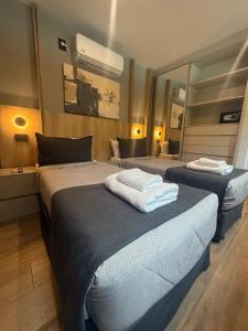 Postel nebo postele na pokoji v ubytování Nuevo Centro Hotel Mendoza