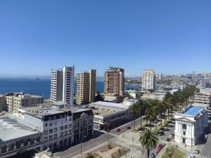 an aerial view of a city with buildings and the ocean at Vista Mar Loft Apartment Downtown Valparaíso in Valparaíso