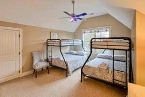 a bedroom with two bunk beds and a ceiling fan at Waterfront Sherrills Ford Home with Pool and Boat Dock in Denver +33 photos