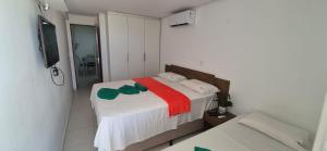 Postel nebo postele na pokoji v ubytování Apartamento 303 - Terrazzas Flat