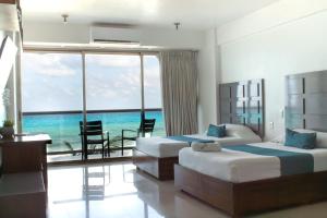 Ένα ή περισσότερα κρεβάτια σε δωμάτιο στο Naia Mar +69 φωτογραφίες