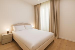 Voodi või voodid majutusasutuse Centro - Executive APT zona pedonale Wi-Fi - AC toas