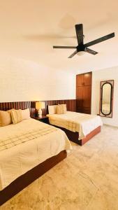 A bed or beds in a room at Finca el Cielo San Carlos Sonora