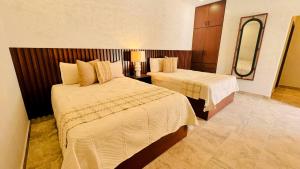 A bed or beds in a room at Finca el Cielo San Carlos Sonora Még 19 kép