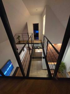 a view of a staircase with a glass floor at villa de luxe avec piscine et jacuzzi xxl in Dourlers