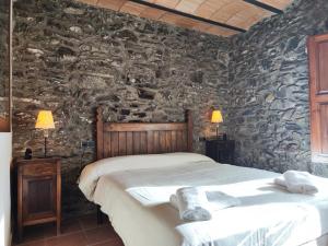 Postel nebo postele na pokoji v ubytování Allotjaments Cal Llarg