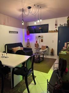 a living room with a table and a couch at A breath of fresh air in Belém in Belém +14 photos