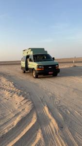 a camper van parked in the desert at Motorhome RV Oman in Muscat +1 photo