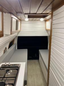 an inside view of a trailer with a stove in it at Motorhome RV Oman in Muscat