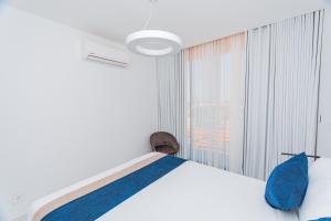 Postel nebo postele na pokoji v ubytování Golf View Apartments + 8 fotografií