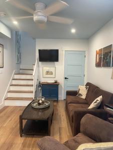 a living room with a couch and a table at Seas the Day Bed and Breakfast in Saint Andrews