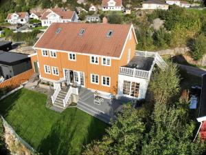 an aerial view of a large orange house at Charming house by the sea in Svenevik