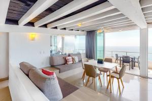 a living room with a couch and a table at Torre Malibu, PH #902 in Puerto Vallarta