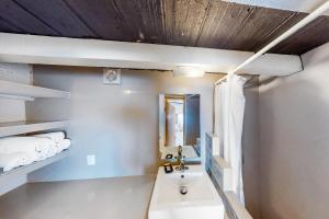 a bathroom with a sink and a mirror at Torre Malibu, PH #902 in Puerto Vallarta +10 photos