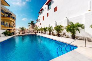 a swimming pool in front of a building at Torre Malibu, PH #902 in Puerto Vallarta