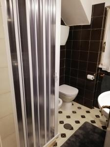 a small bathroom with a toilet and a sink at Sunset House in Santa Marinella +18 photos