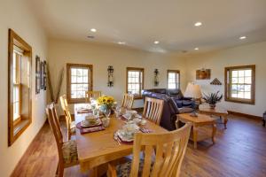 a dining room and living room with a table and chairs at McJuggers Loft Walk to Lake, Park, Restaurants in Campbellsport +16 photos