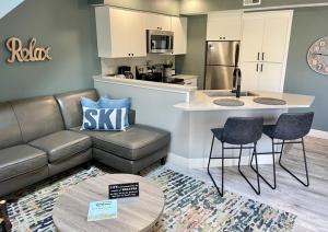 a living room with a couch and a kitchen at Wintergreen Condo, Unit #543 in Thompsonville