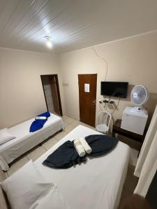 Ένα ή περισσότερα κρεβάτια σε δωμάτιο στο Hotel Raio do Sol