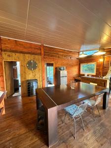 a large dining room with a large wooden table at Macondo in Sauce de Portezuelo