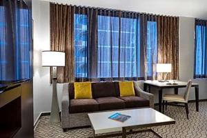 a living room with a couch and a table at The Donatello in San Francisco