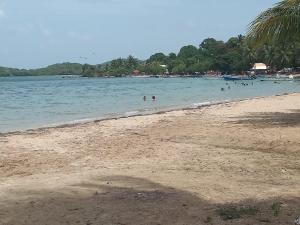 a group of people in the water at a beach at Villa Soussoute - à 2mn de la plage de Tartane in La Trinité +3 photos