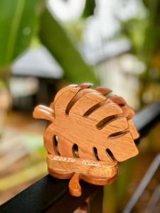 a wooden hand toy sitting on top of a table at Exclusive Rainforest Villas in Tapantí