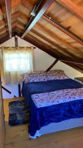 Ένα ή περισσότερα κρεβάτια σε δωμάτιο στο Chalé de Ferro visconde de mauá