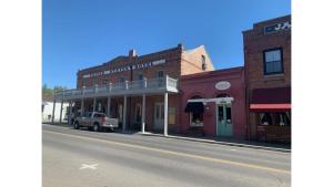 an empty street in a small town with buildings at C Street Cottages in Jacksonville +7 photos