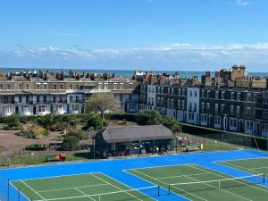 an image of a tennis court and buildings at Ramsgate Retreats at Latimer House in Ramsgate