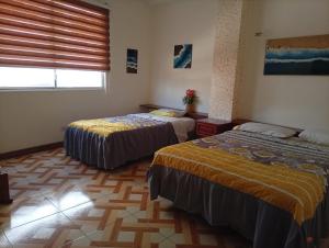 Postel nebo postele na pokoji v ubytování Hostal Shaddai