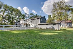 a house with a large yard in front of a building at Peaceful Country Apt Extended Stays Welcome! in Pataskala