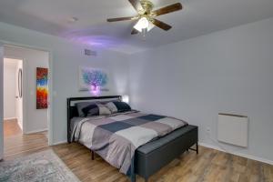 a bedroom with a bed with a ceiling fan at Peaceful Country Apt Extended Stays Welcome! in Pataskala