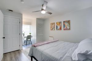a white bedroom with a bed and a ceiling fan at 21 Mi to Dtwn Columbus Quiet Country Escape in Pataskala
