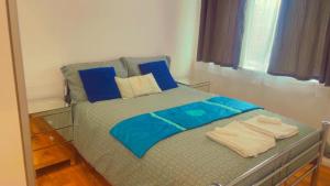 Ένα ή περισσότερα κρεβάτια σε δωμάτιο στο Maxismile Haven