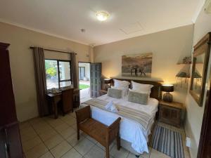 Postel nebo postele na pokoji v ubytování Afri-Lala Bed & Breakfast