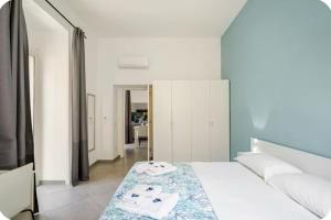 Ένα ή περισσότερα κρεβάτια σε δωμάτιο στο Duomo 34 Guest Room