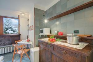 a kitchen with a counter with a pot on it at Fiori di Miele - Happy Rentals in Bardonecchia