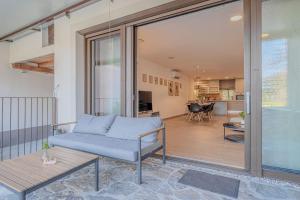 a living room with a couch and a table at Vipava River Retreat - Happy Rentals in Vipava +28 photos
