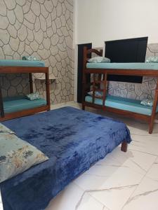 Postel nebo postele na pokoji v ubytování Casa em Furnas - Capitólio 100Mts da Água