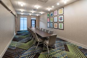 a conference room with a long table and chairs at Holiday Inn Express Durango Downtown- Animas River in Durango +68 photos